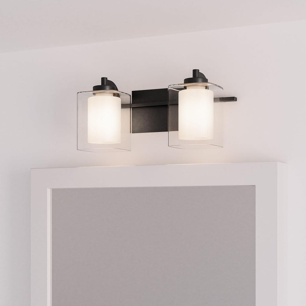 Quoizel Kolt Modern Vanity Lights, 2-Light, 18 Inch Matte Black Bathroom Lighting Fixtures Over Mirror, Sandblasted Inner Glass, 100 W A19 Bulb, Wall Mount Light for Bathrooms, Kitchen or Hallway